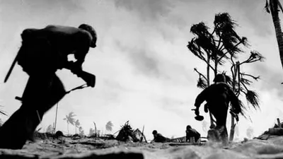 pg 175U.S. troops advance on Tarawa, Gilbert Islands.After the Navy had turned back Japanese attempts on Port Moresby and Midway Island, inflicting heavy damage on the Japanese fleet, the United States assumed theoffensive in the Pacific for the first ti